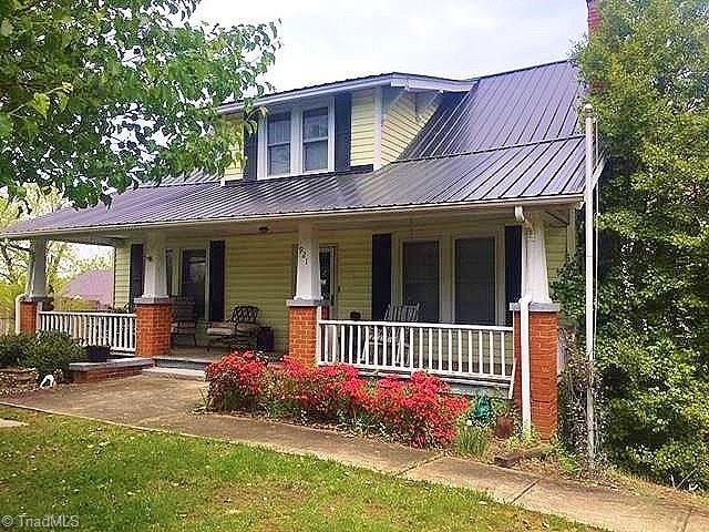 Adorable craftsman farmhouse with rocking chair front porch!