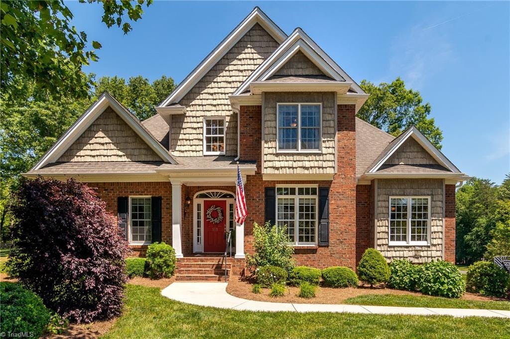 Lovely brick home with many architectural details.