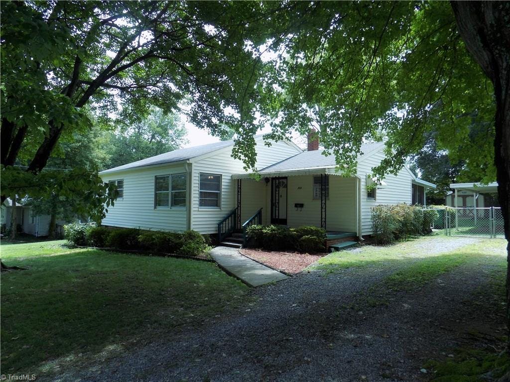 Cute as a button, 1950's cottage features 3BR, 1BA with large living room, fenced yard, screened porch and carport.