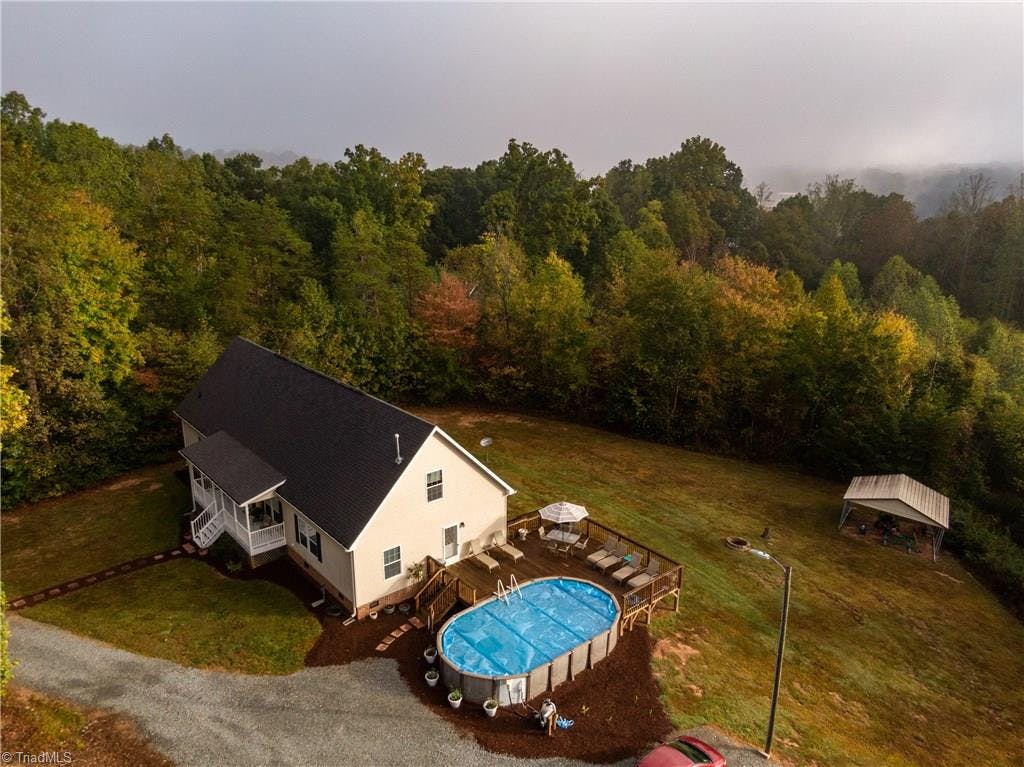 Come see this spectacular home with privacy and beauty on acre lot near town in Walnut Cove