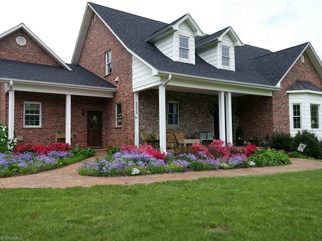 Beautiful Spring and Summer perrenials add to the natural beauty of this amazing home!