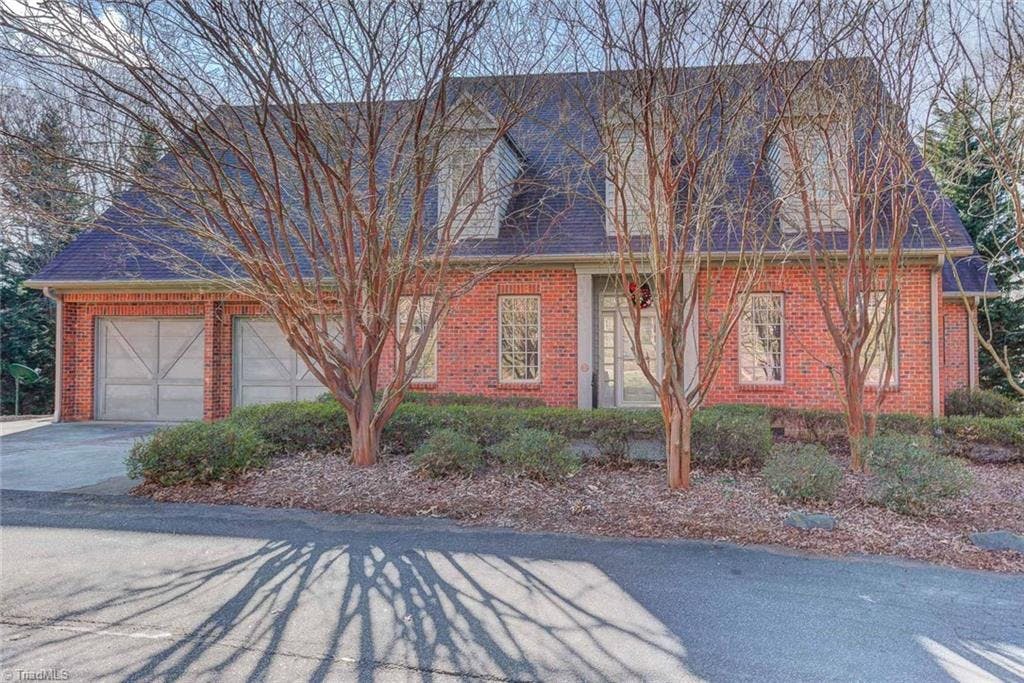 Small Private Community just minutes from Silas Creek Pkwy.  All Brick custom built home by Gary Elliot. Lowest Priced Home Per Square Ft in the community!