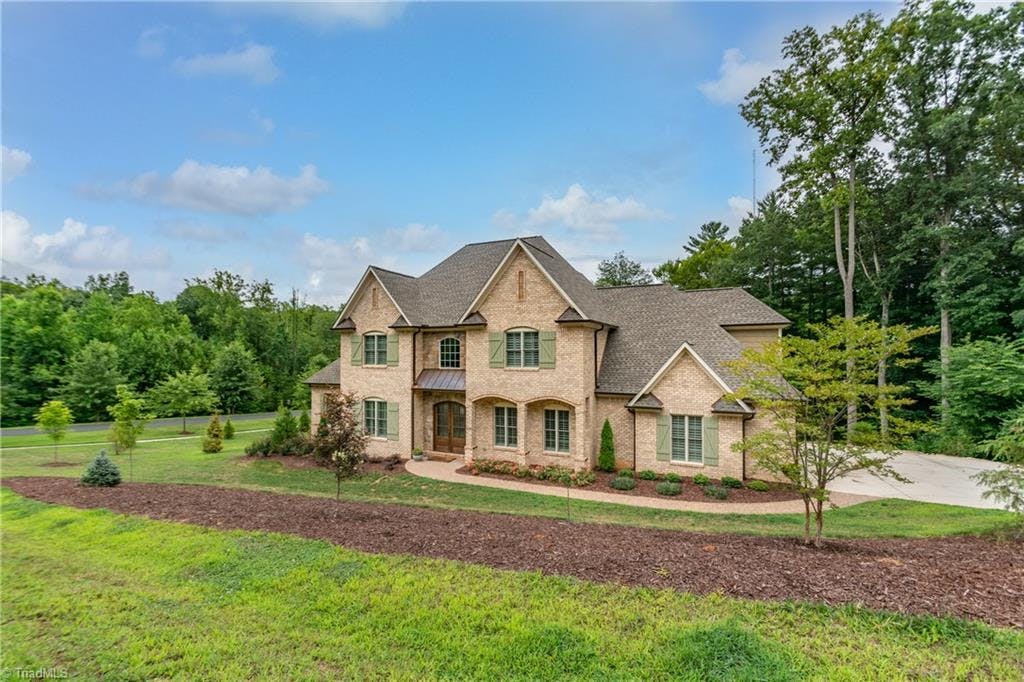 This stunning home sits on 1+ acres in the exclusive Henson Farms neighborhood in Summerfield.