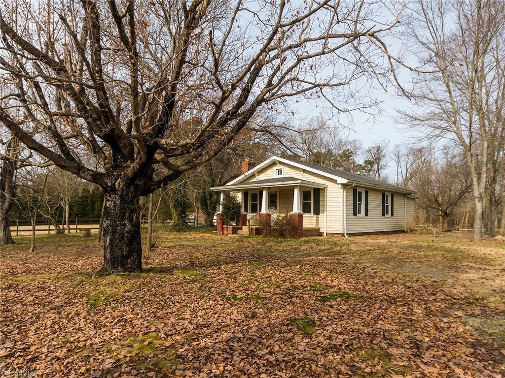 This 2BR/1BA farm house could be renovated into a lovely home on over 2.7 acres of land!
