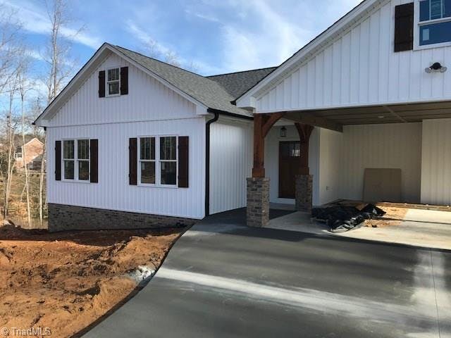 Front view of house with front door, dark gutters and pavement. 12/28/19