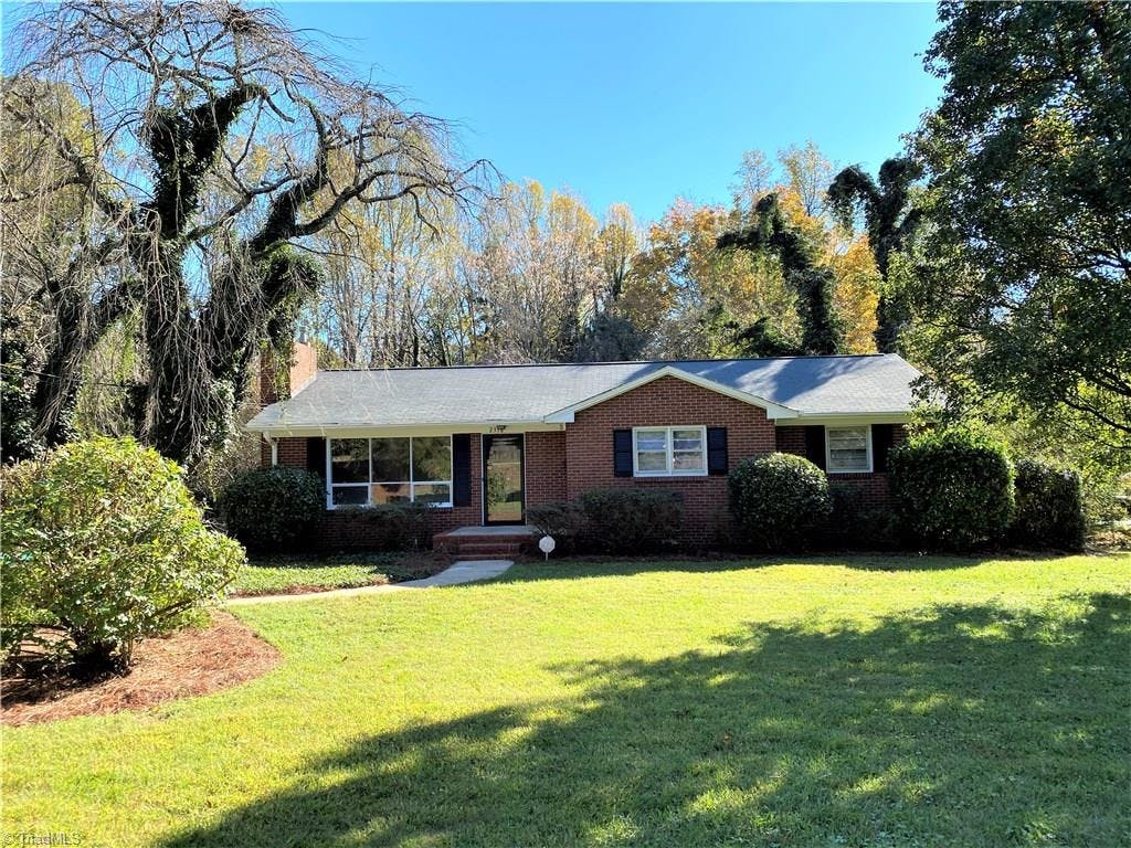 1 level brick home on a tree lined lot with mature landscaping.  Move in ready.