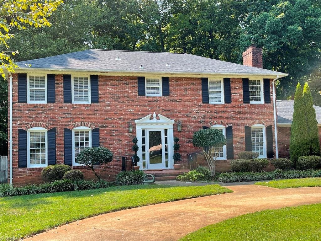 2 Story brick home with circle drive.