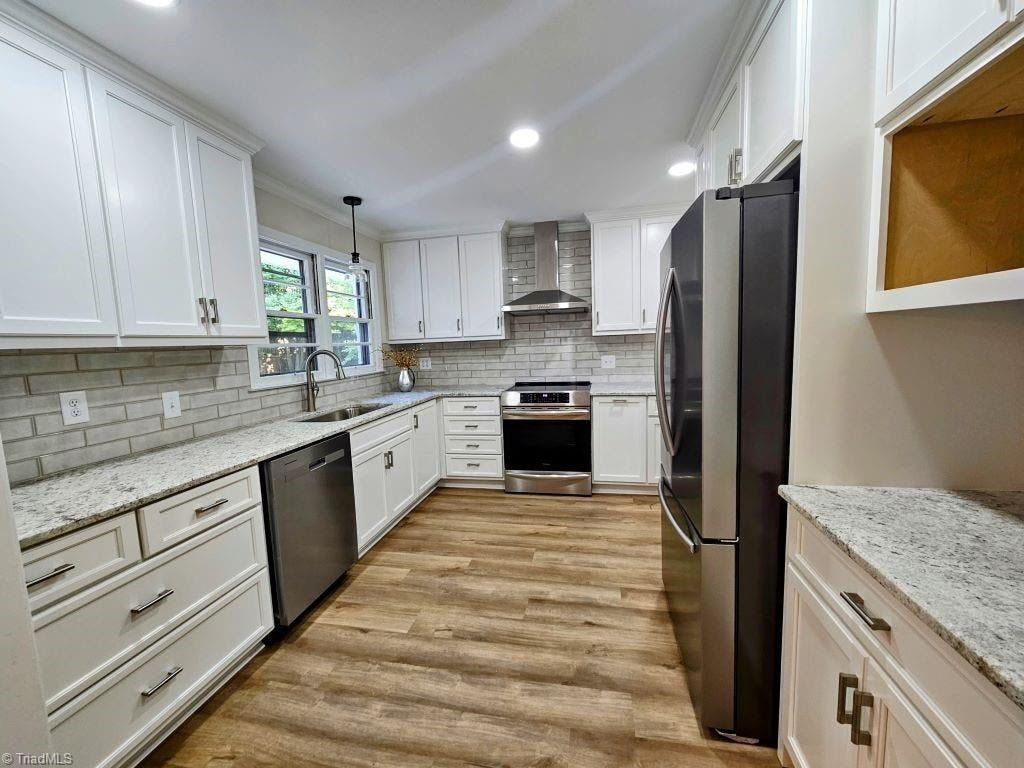 All new kitchen with lots of cabinets and stainless appliances. Refrigerator remains.