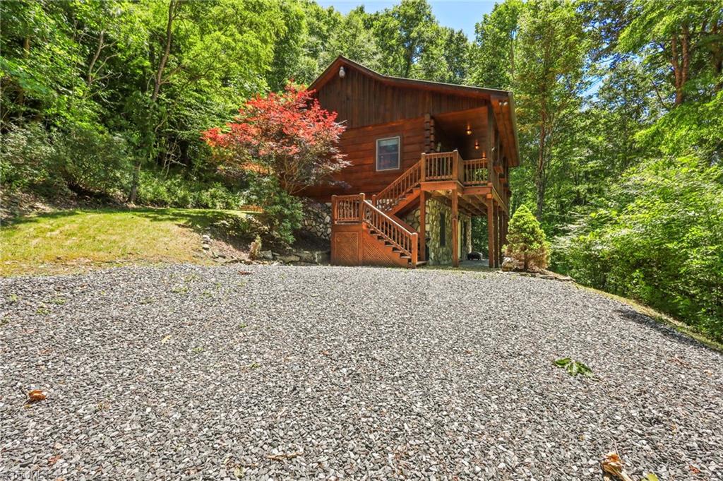 Welcome Home to this cozy log cabin on top of the ridge