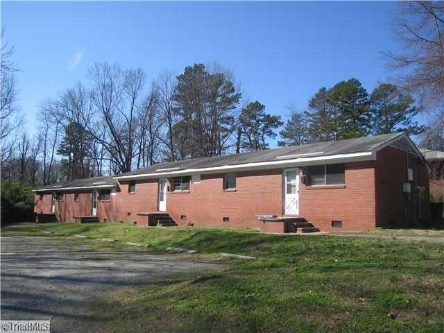 Exterior Front. All brick, recent paint, carpet, $400/Mo Unit Lease. 2nd parcel part of price, additional .65 of land!