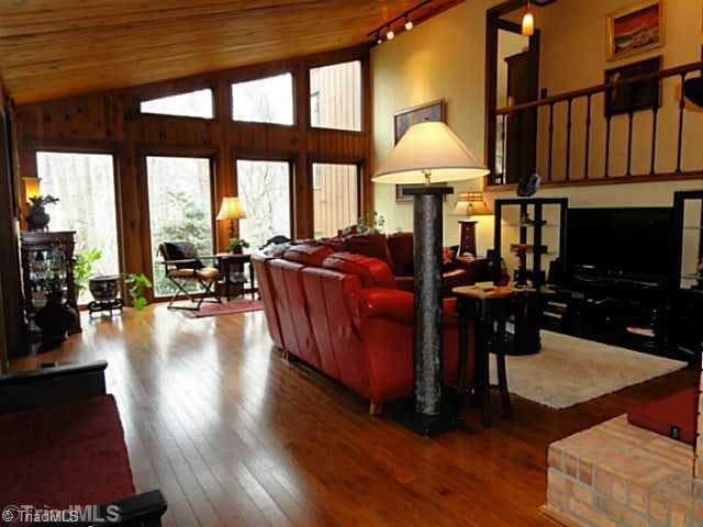 Living Room. Beautiful wood flooring, large windows allowing in natural light, gas logs, just the perfect living space