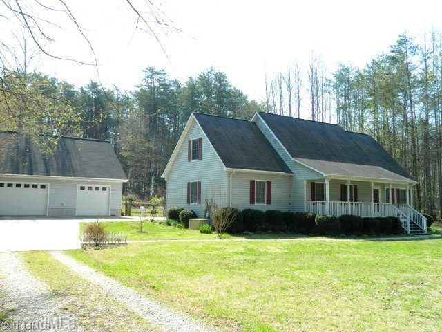 Exterior Front. Great County Cape on 2+ Acres!  Oversized 2 car garage, septic and well in front so wide open rear yard for pool!