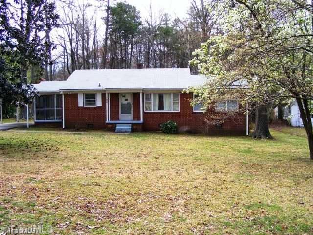 Exterior Front. One owner brick home sits on .91 acre.  Easy access to downtown or highways.