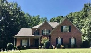 Two story transitional all brick home on 1.43 acres.  Pretty covered porch