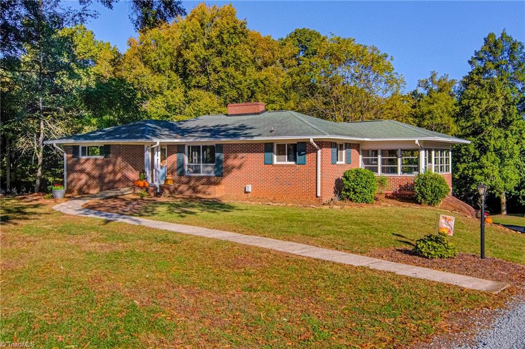Welcome to this Mid-Century Modern Ranch beautifully renovated with potentially 2 living quarters sitting on 2.69 acres conveniently located near Hwy 158 & the new Winston Salem Northern Beltway.