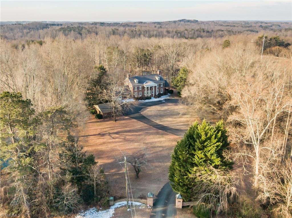A Country Estate right in Town on 11.74 Acres with a pond!