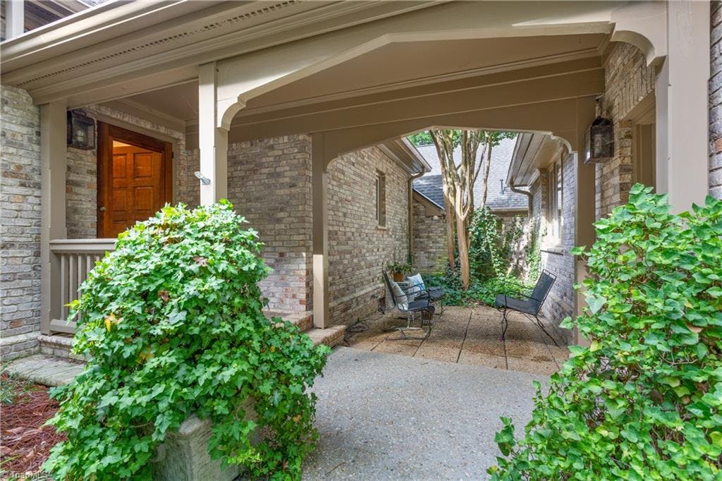 The front courtyard offers a peaceful retreat for you morning coffee. It is between the front door and covered walkway to garage.