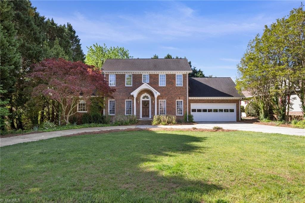 Brick home in Country Club Forest with TWO primary suites on MAIN!