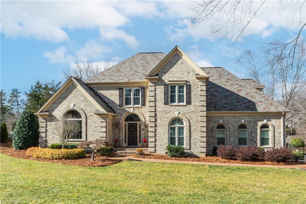 Welcome home to 3413 Donnington Court!  This custom home is nestled on a quiet cul-de-sac street in the prestigious Sedgefield Country Club golf community.