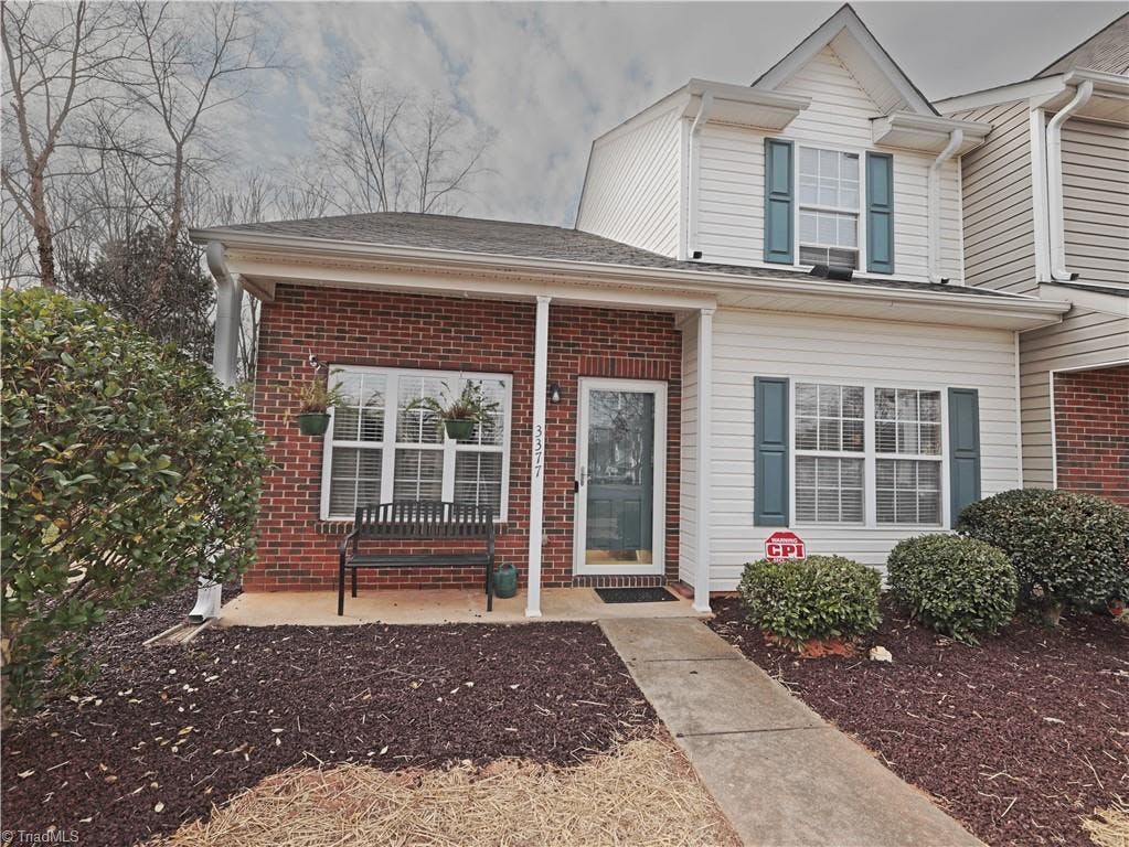 End unit townhome with welcoming front porch!