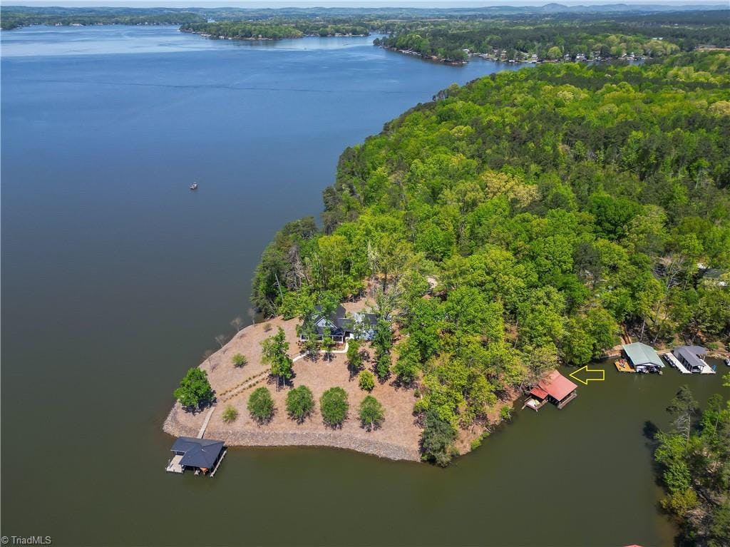 Just around the point to the right one of the widest areas along Lake Tillery.  A great place for sailing. skiing and fishing.  Red roofed bat house offers pontoon, boat, and jet ski lift.